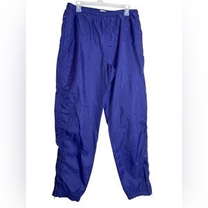 Nike wind pants jogger women’s size large (12-14) Purple